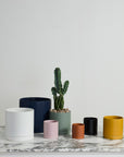 Romey planter styled on a shelf